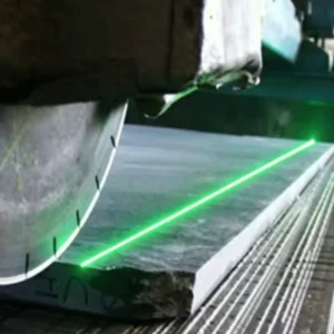 Line laser positioning module projecting beam on stone for cutting alignment